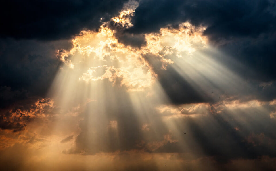 Sunlight through clouds symbolizing Jesus as the propitiation for our sins